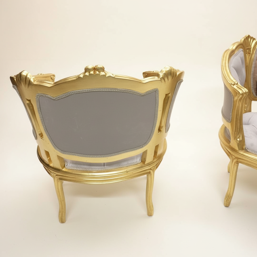 Louis XV gilt wood armchairs back view — cream background